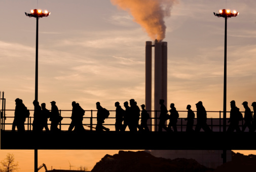 industrial workers in a line