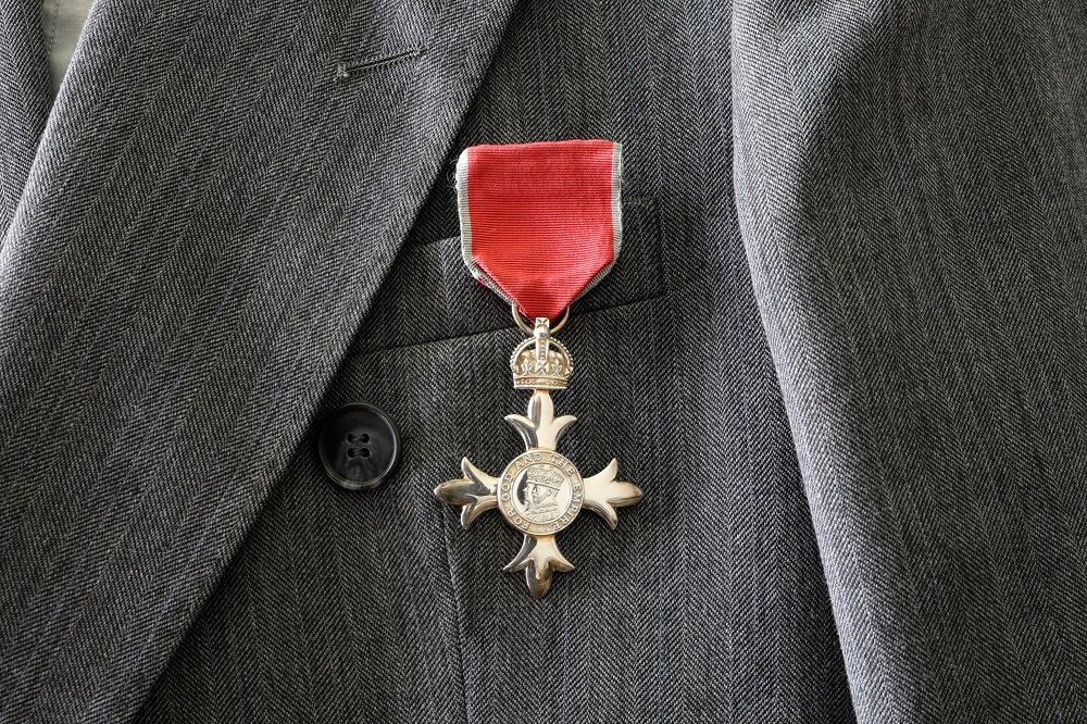 British MBE medal worn on grey suit